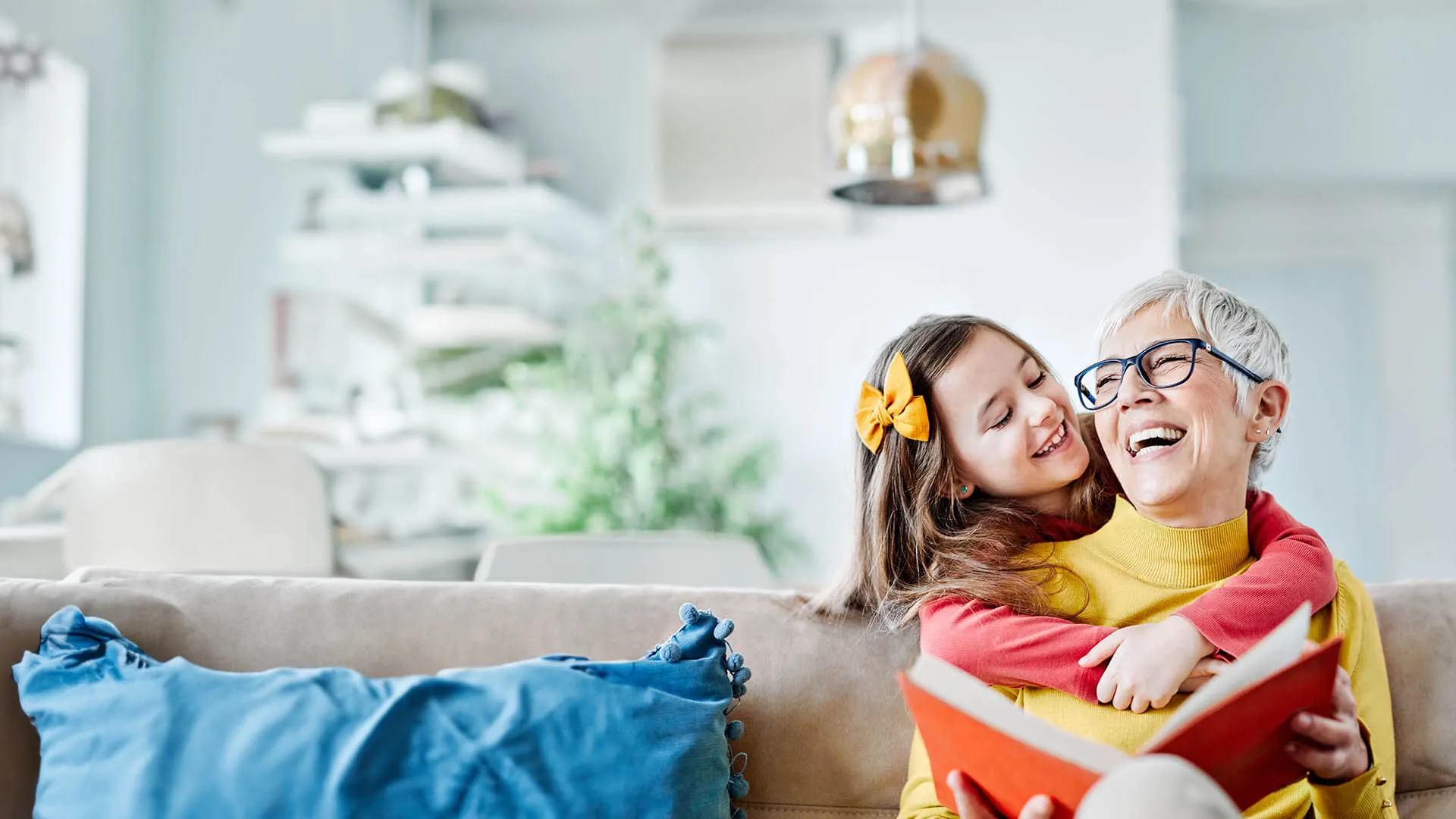 a woman and a girl playing with a toy