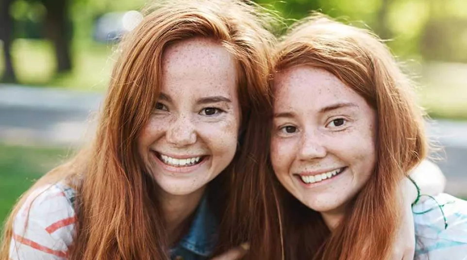a couple of women embracing